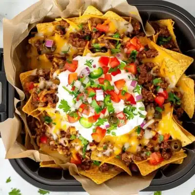 Quick And Easy Air Fryer Nachos: The Best Recipe. Discover The Ultimate Game-Changer In Snack Preparation With Our **Air Fryer Nachos Recipe**. If You’ve Been Baking Nachos In The Oven, You’ll Never Go Back After Trying This Quick And Easy Air Fryer Method. Ready In Just Minutes, These Nachos Come Out Perfectly Crispy And Evenly Cooked Every Time. One Of The Keys To Success With This Recipe Is Balance. Using More Beans Than Originally Called For Can Add Extra Protein And Flavor, But Be Cautious With The Salsa. Distributing It Evenly Prevents Soggy Spots, Ensuring Each Bite Is Perfect. This Recipe Is Incredibly Versatile And Can Be Tailored To Your Taste Preferences. Add Jalapeños For A Spicy Kick, Or Sprinkle On Extra Cheese For A Gooey Delight. Courtesy Of Everyday Family Cooking, These Air Fryer Nachos Are Ideal For Quick Snacks, Game Day Celebrations, Or Casual Get-Togethers. The Air Fryer Not Only Speeds Up The Cooking Process But Also Ensures That Your Nachos Are Evenly Crisped, Making For A Deliciously Satisfying Snack Everyone Will Love.