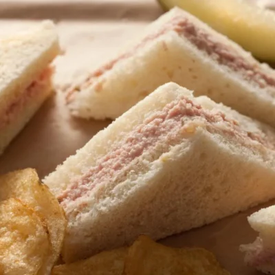 A Nice Luncheon Ham Spread Which Is Served As A Cheese Ball With Egg Wedges And Dill Pickles Surrounding It