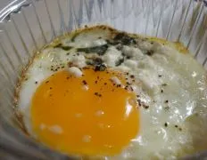 Baked Eggs With Fresh Herbs And Goat Cheese