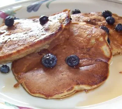 Banana Pecan Pancakes Served With Berries