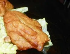 Cajun Parsnip Fritters On Baby Spinach