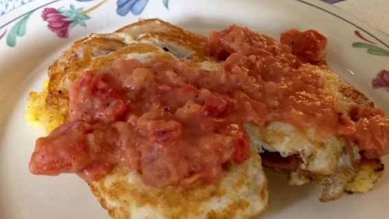 Fried Grit Cakes With Eggs And Tomato Gravy