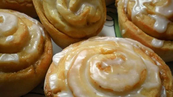 From Southern Living 1981 comes this recipe for sweet rum-flavored buns laced with raisins and cinnamon and topped with a sugary glaze This yields 2 dozen buns and they freeze beautifully