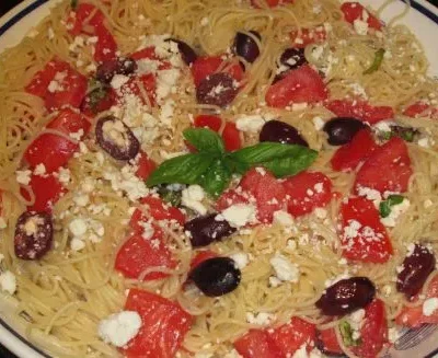 Garlic-Infused Spaghetti With Juicy Tomatoes And Black Olives