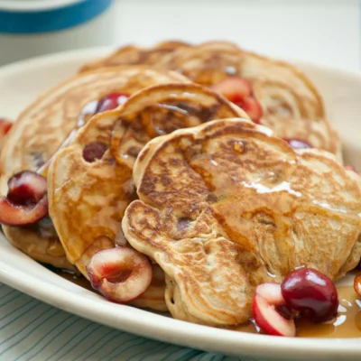 Healthy Whole Wheat Pancakes Topped With Fresh Fruit Medley