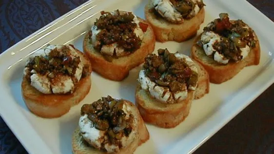 Marinated Goat Cheese Rounds With Crostini