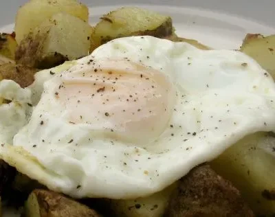 Potato And Onion Hash With A Fried Egg For