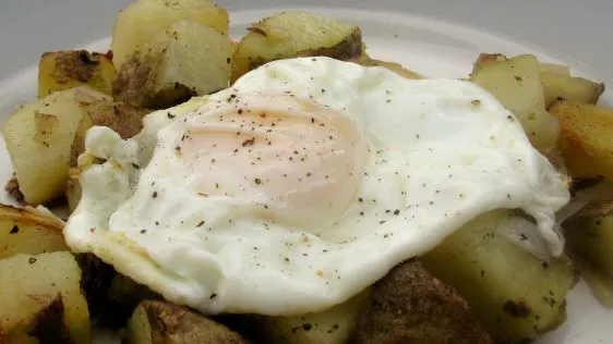 Potato And Onion Hash With A Fried Egg For