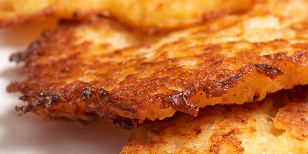 Potato, Carrot, And Onion Latkes With Spiced Sour