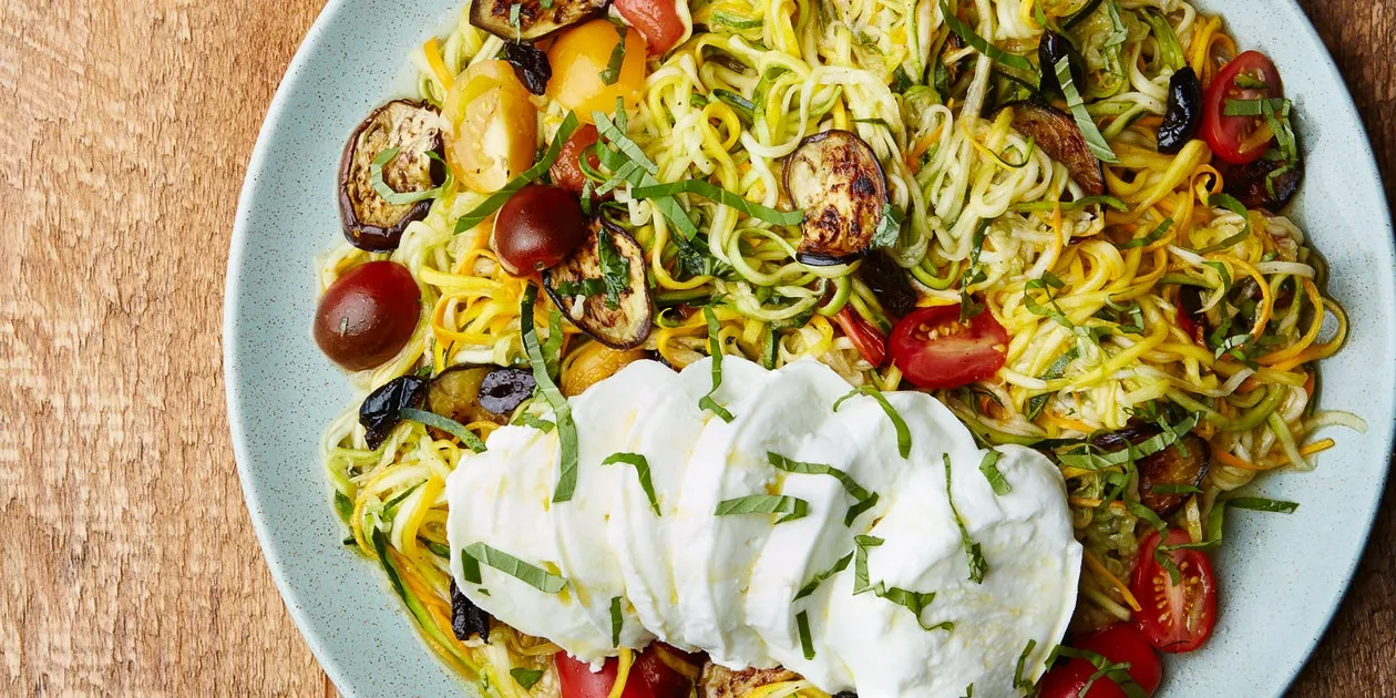 Raw Spiralized Zucchini Noodles With Tomatoes And Pesto