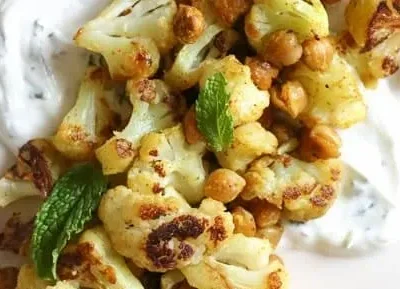 Roasted Cauliflower And Chickpeas With Minted Yogurt