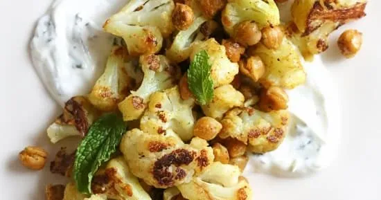 Roasted Cauliflower And Chickpeas With Minted Yogurt