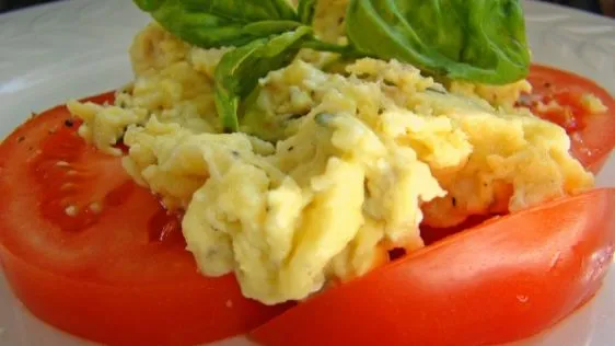 Scrambled Eggs Over Fresh Sliced Tomatoes