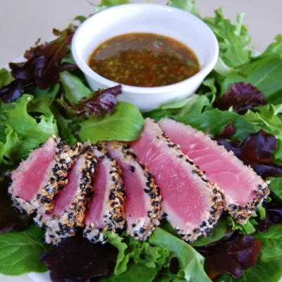 Sesame Crusted Tuna Steak On Arugula