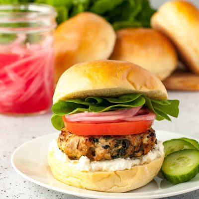 Chicken Tomato And Feta Patties On A Spinach