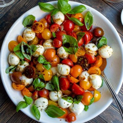 Classic Caprese Salad With A Twist: Roasted Peppers And Fresh Mozzarella