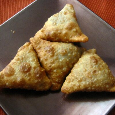 Curry-Spiced Samosas With Plum And Tomato