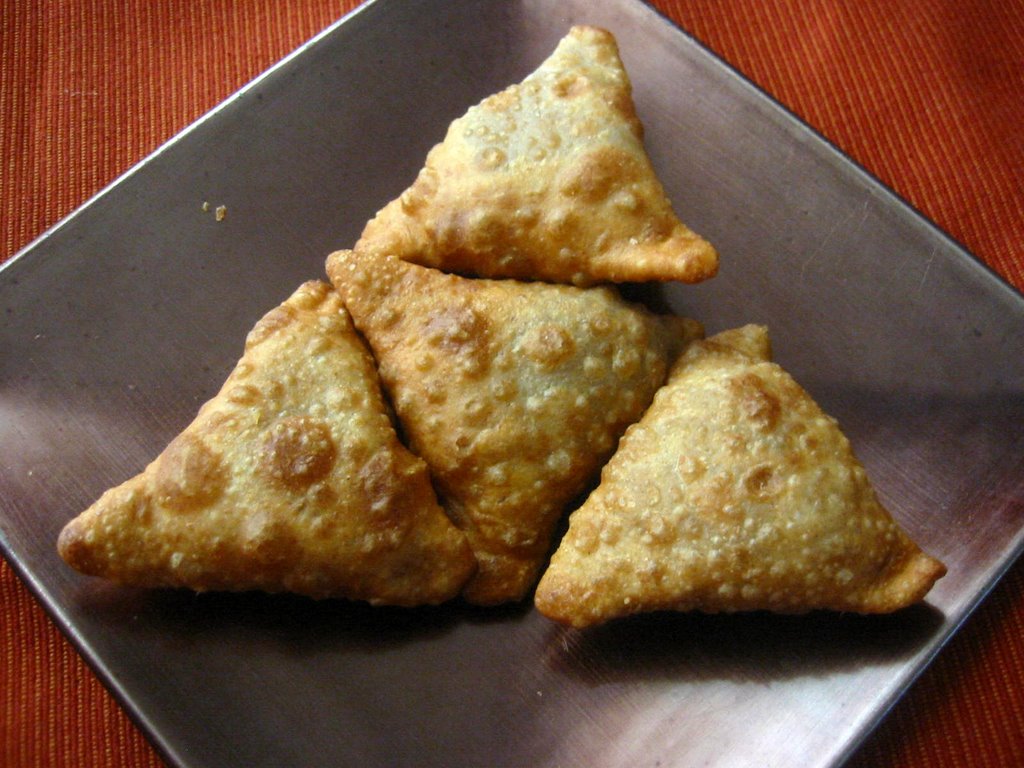 Curry-Spiced Samosas With Plum And Tomato