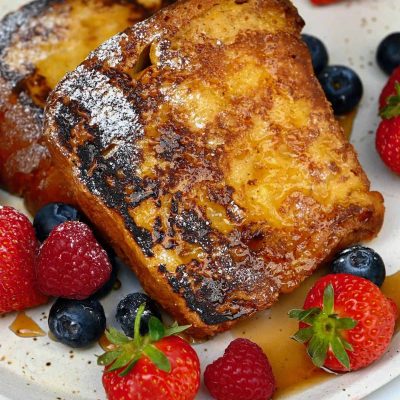 Maple-Vanilla French Toast Topped With Fresh Raspberries