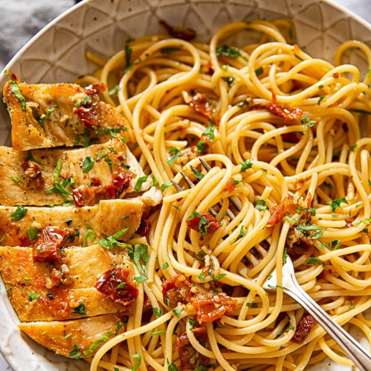 Mediterranean-Style Chicken Pasta with Sun-Dried Tomato Pesto