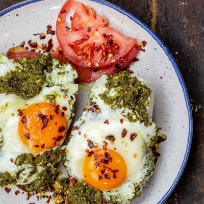 Scrambled Eggs Over Fresh Sliced Tomatoes